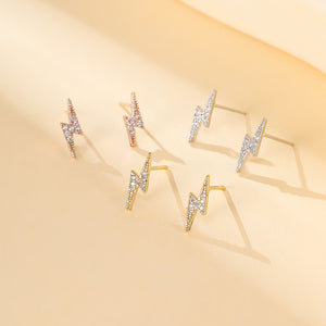 90. Tiny sparkly lightning flash studs in gold