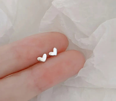 107. Super tiny silver heart earrings