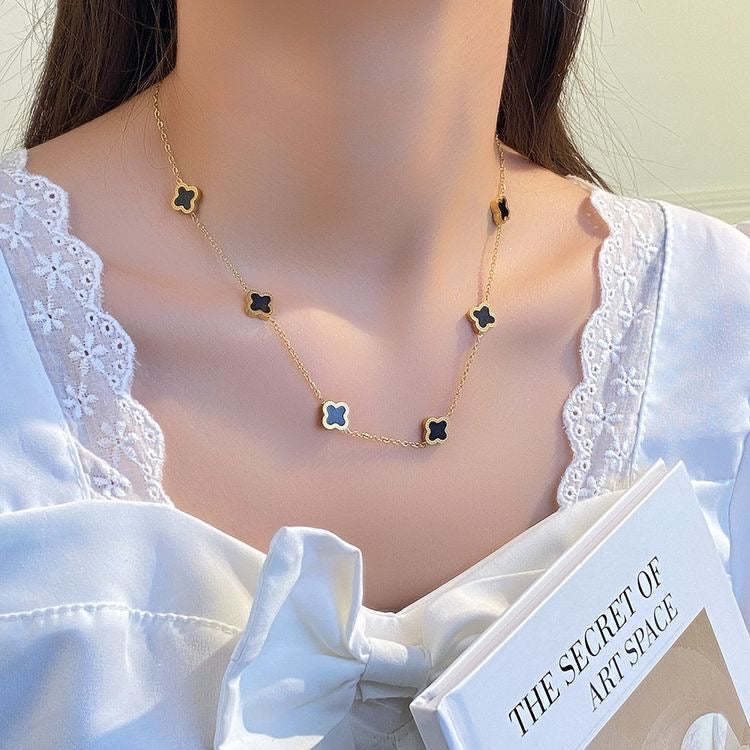 Four leaf clover necklace in gold & black