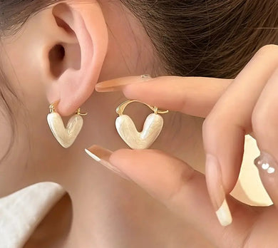 105. Lovely cream enamel heart earrings