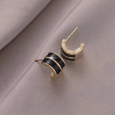68. Tiny black & gold huggie stud earrings