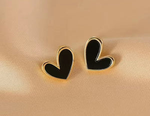 104. Black heart on gold stud earrings