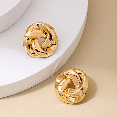127. Twisted 80’s inspired stud earrings in gold